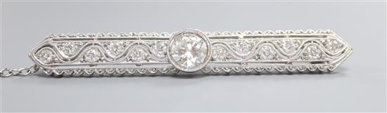 A modern 1920s style pierced 750 white metal and diamond set bar brooch, 58mm.